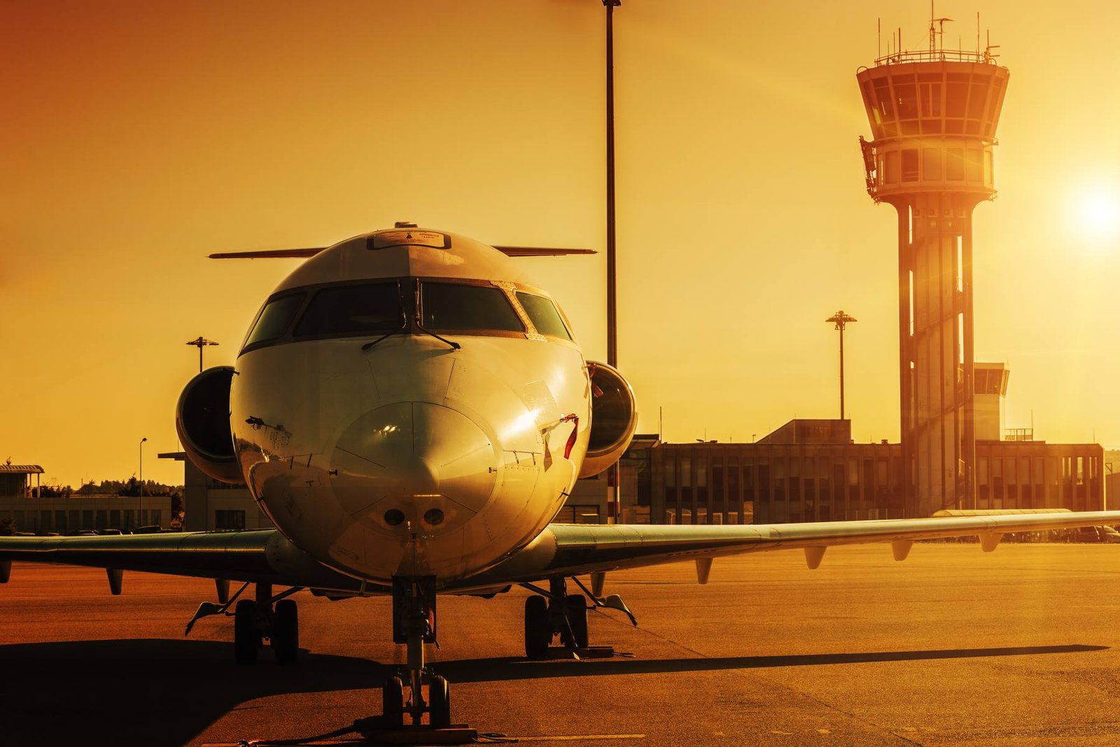 Aircraft at an airport stand at sunset on an international route